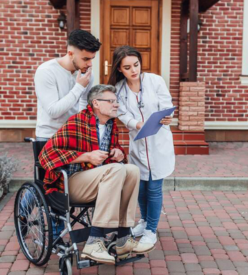 A Crescent Wound Care clinician reviewing a treatment plan with a resident and their family member